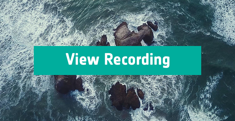Aerial view of splashing waves on rocks